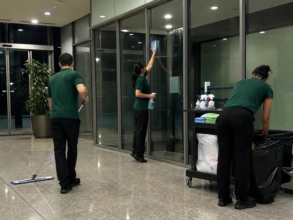 Berg Maintenance cleaners working an after-hours shift in a commercial building